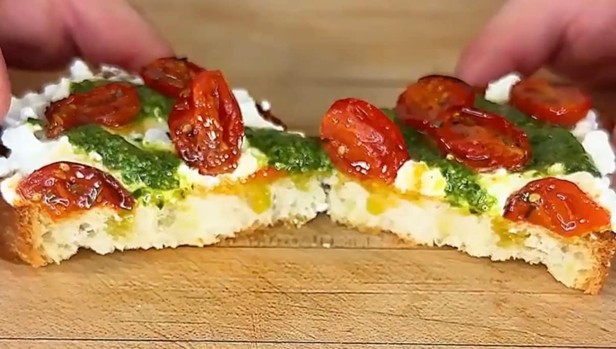 crostone made with stracciatella, confit cherry tomatoes and basil pesto