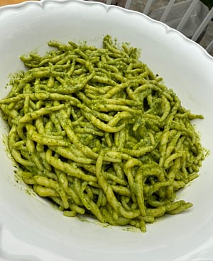 Trofie al Pesto made with fresh basil pesto, Parmigiano Reggiano, pine nuts, and Ligurian trofie pasta.