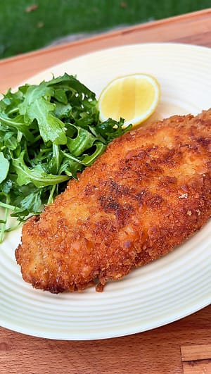 chicken milanese with arugula salad and lemon