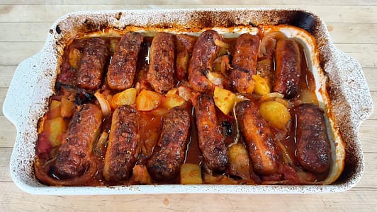 italian sausage and potatoes baked with tomatoes and onions