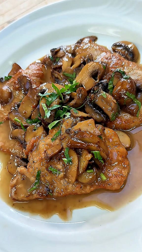 veal marsala with mushrooms in a rich wine sauce