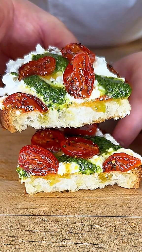 crostone made with stracciatella, confit cherry tomatoes and basil pesto