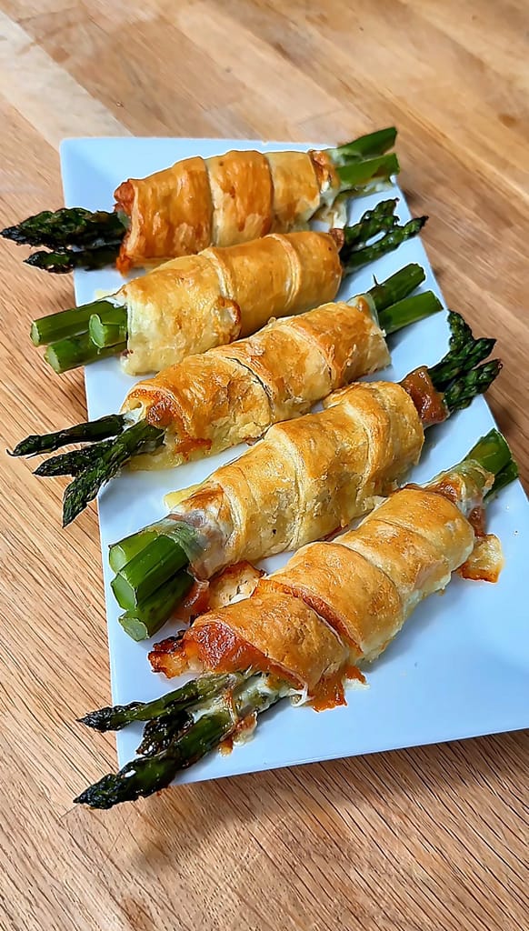 Puff Pastry Asparagus bundles wrapped with Prosciutto di Parma and sharp provolone baked until golden brown and flaky.
