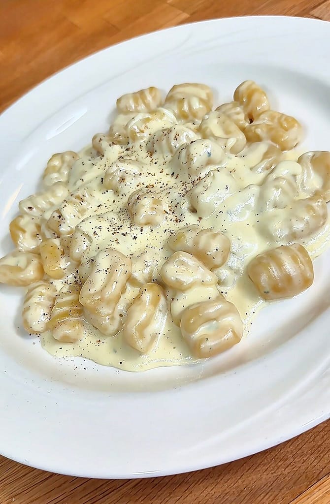 gnocchi ai quattro formaggi made with asiago, fontina, gorgonzola dolce and parmigiano reggiano