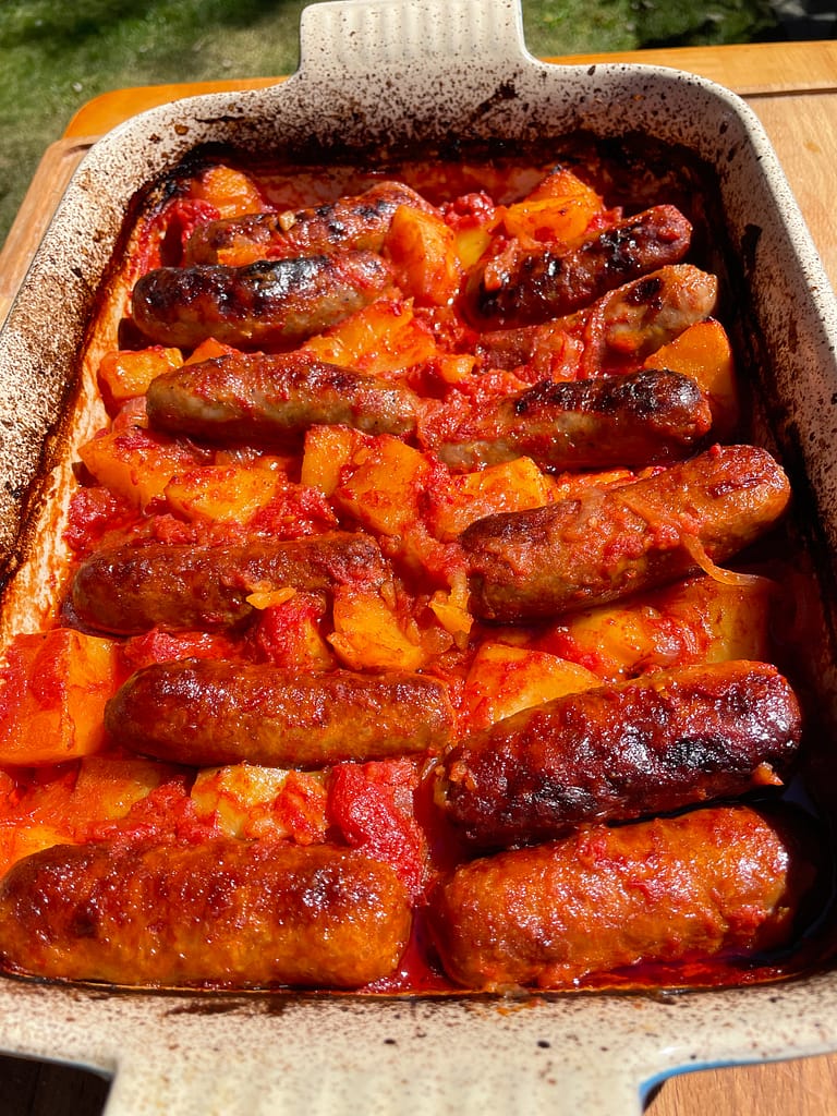 italian sausage and potatoes baked with tomatoes and onions